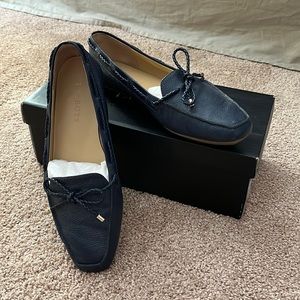 Talbots navy loafers with braided bow tie and silver hardware.